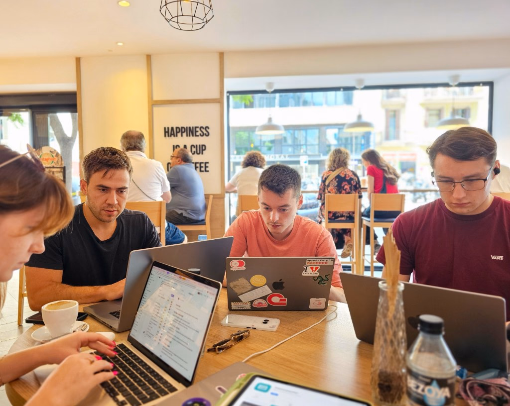Appwrite team members working together at a cafe in Barcelona